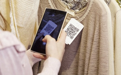 Consumer scans QR code on a product label